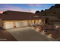 Charming single-story home featuring a three-car garage, desert landscaping, and mountain views at 4846 S Rimrock Loop, Gold Canyon, AZ 85118