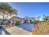 Beautiful single-Gathering home with desert landscaping, long driveway, and two-car garage at 1157 W Desert Lily Dr, San Tan Valley, AZ 85143