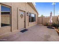 Welcoming front entrance featuring a charming wreath and neutral-toned exterior at 1310 S Pima -- # 35, Mesa, AZ 85210