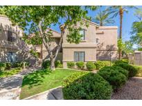 Charming two-story condo showcasing well-maintained landscaping and beautiful curb appeal at 15252 N 100Th St # 1156, Scottsdale, AZ 85260