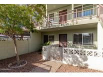 Charming condo featuring secure gated entry, well-maintained yard, and a private balcony at 1702 W Tuckey Ln # 124, Phoenix, AZ 85015