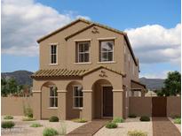 Charming two-story home with tan stucco exterior and landscaped front yard at 26029 N 23Rd Ave, Phoenix, AZ 85085