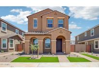 Charming two-story home featuring a well-manicured front yard and inviting entryway at 26029 N 23Rd Ave, Phoenix, AZ 85085