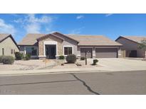 Charming single-story home with a three-car garage and well-maintained landscaping at 2851 N Ricardo --, Mesa, AZ 85215