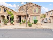 Charming two-story home featuring stone accents, desert landscaping, and neutral color palette at 34916 N 31St Ave, Phoenix, AZ 85086