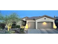 Inviting single-story home featuring desert landscaping, a neutral color scheme and a two-car garage at 41802 N Bridlewood Way, Anthem, AZ 85086