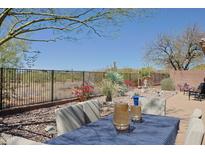 Inviting patio with mountain views, perfect for outdoor dining and relaxation in a serene setting at 41802 N Bridlewood Way, Anthem, AZ 85086