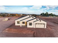 Attractive single-Gathering home featuring modern architectural details, nestled in an inviting desert neighborhood at 1207 N 362Nd Ave, Tonopah, AZ 85354