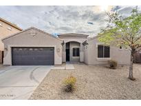 Charming single-story home with a two-car garage and desert landscaping at 15853 N 74Th Ave, Peoria, AZ 85382