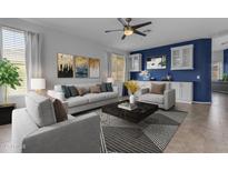 Spacious living room featuring modern decor, stylish furnishings, and a beautiful accent wall with built in cabinetry at 2882 E Indian Wells Pl, Chandler, AZ 85249
