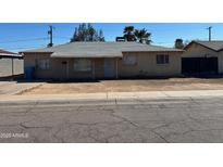 Charming single-story home featuring a covered front porch and desert landscaping at 3211 W Bethany Home Rd, Phoenix, AZ 85017