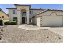 Inviting two-story home featuring a two-car garage and low-maintenance desert landscaping at 493 E Baylor Ln, Gilbert, AZ 85296
