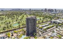 Breathtaking aerial view of a high-rise building overlooking lush golf course and city skyline at 1040 E Osborn Rd # 1801, Phoenix, AZ 85014