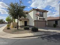 Two-story home featuring a desert landscape, and a two-car garage at 1044 S Mosley Dr, Chandler, AZ 85286