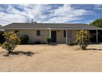 Charming single-story home with desert landscaping and mature yellow flowering shrubs at 1337 W Elna Rae St, Tempe, AZ 85281