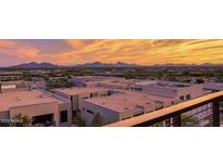 Expansive city and mountain views at sunset from the community's rooftop deck at 15215 N Kierland Blvd # 633, Scottsdale, AZ 85254