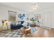 Bright living room with stylish furniture, hardwood floors, and plenty of natural light at 309 W Campbell Ave, Phoenix, AZ 85013