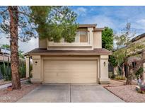 Charming two-story home featuring a two-car garage and desert landscaping, inviting you to call it home at 730 E Rosemonte Dr, Phoenix, AZ 85024