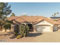 Charming home features a well-manicured xeriscaped front yard and a tile roof at 14218 W Via Montoya --, Sun City West, AZ 85375