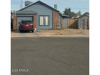 Charming single-story home featuring a front-facing garage and a neatly maintained front yard at 1608 W Curry Dr, Chandler, AZ 85224