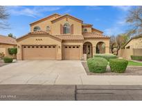 Expansive two-story home featuring a three-car garage, desert landscaping, and a beautiful neutral color palette at 2280 E Aloe Pl, Chandler, AZ 85286