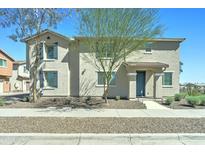 Charming two-story home featuring desert landscaping, neutral stucco, shutters, and a covered entryway, perfect for a Gathering at 2315 N 73Rd Dr, Phoenix, AZ 85035
