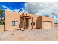 Inviting single-story home with wood beam entryway and xeriscape landscaping at 26015 S Grapefruit Dr, Queen Creek, AZ 85142