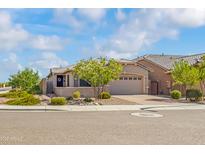 Charming single-story home featuring well-maintained landscaping and a welcoming entrance at 4121 W Bradshaw Creek Ln, New River, AZ 85087