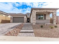 Charming single-story home with stone accents, covered porch, and a well-manicured front yard at 16517 S 7Th Pl, Phoenix, AZ 85048