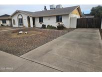 Charming single-story home with a driveway and low-maintenance rock landscaping at 3646 W Mescal St, Phoenix, AZ 85029