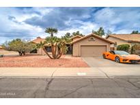 Charming single-story home with well-maintained landscaping and an attached two-car garage at 372 W Larona Ln, Tempe, AZ 85284