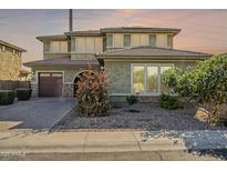 Charming two-story home features neutral colors, well-manicured landscaping, and an attached two-car garage at 3901 S Adobe Dr, Chandler, AZ 85286