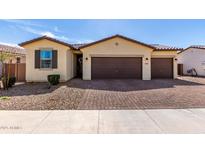 Charming single-story home featuring a three car garage and neutral color palette at 40385 W Haley Dr, Maricopa, AZ 85138