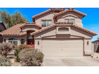 Charming two-story home with a tile roof, neutral stucco, and a two car garage at 41838 W Anne Ln, Maricopa, AZ 85138