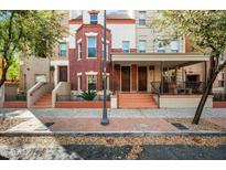 Inviting multi-level townhome with covered porch, brick accents, and landscaped front steps at 567 W 6Th St, Tempe, AZ 85281