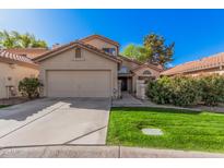 Charming single-Gathering home featuring a well-maintained lawn and a two-car garage at 73 E Caroline Ln, Tempe, AZ 85284