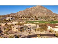 Stunning aerial view of a Southwestern home showcasing mountain views and a golf course at 10801 E Happy Valley Rd # 86, Scottsdale, AZ 85255