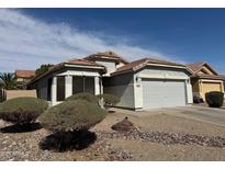 Charming single-story home featuring desert landscaping and a two-car garage at 25798 W Miami St, Buckeye, AZ 85326