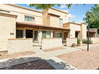 Inviting townhome exterior with a well-maintained walkway and covered patios at 4608 W Maryland Ave # 122, Glendale, AZ 85301