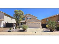 Charming two-story home featuring a two-car garage and desert landscaping at 23217 N 22Nd Pl, Phoenix, AZ 85024