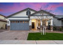 Charming single-story home with a well-manicured lawn, brick accents, and a welcoming front porch at 3929 E Appaloosa Rd, Gilbert, AZ 85296