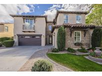Beautiful two-story stucco home with a tile roof, stone accents, and well-manicured landscaping at 4576 E Waterman St, Gilbert, AZ 85297
