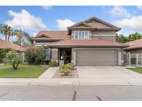 Charming two-story home featuring a well-manicured lawn and a neutral color palette at 5755 W Harrison St, Chandler, AZ 85226