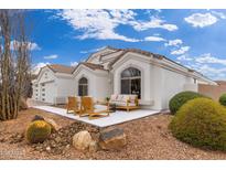 Charming home exterior boasting a cozy patio area and desert-friendly landscaping for a serene ambiance at 7717 E Black Rock Rd, Scottsdale, AZ 85255