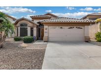 Inviting single-story home showcasing a desert landscape, tile roof, and a neutral-toned facade at 9631 E Palm Ridge Dr, Scottsdale, AZ 85260