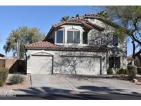 Charming two-story home featuring a spacious three-car garage and well-maintained landscaping at 1353 S Western Skies Dr, Gilbert, AZ 85296