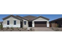 Charming single-story home featuring a well-maintained front yard and attached two-car garage at 24098 N 172Nd Ave, Surprise, AZ 85387