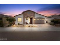 Charming single-Gathering home featuring a well-manicured front yard and cozy porch seating at 24275 N 173Rd Ave, Surprise, AZ 85387