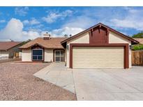 Charming single-story home with a two-car garage and well-maintained landscaping at 7414 W Tuckey Ln, Glendale, AZ 85303