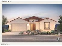 Inviting single-story home with a two-car garage and beautiful desert landscaping at 17651 W Palo Verde Dr, Litchfield Park, AZ 85340